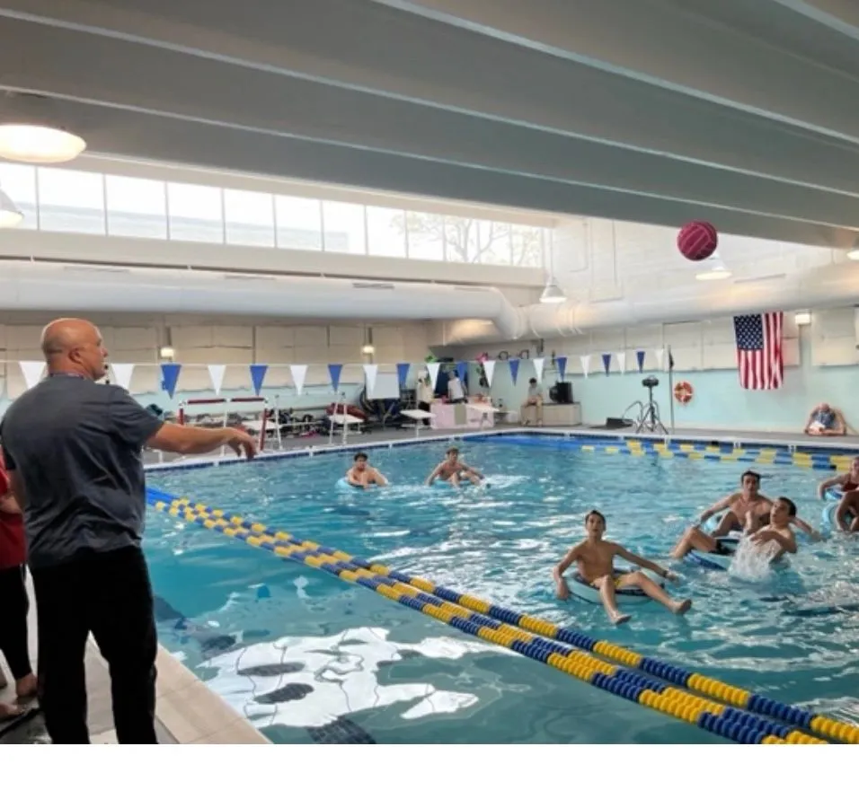 Community members in an indoor pool