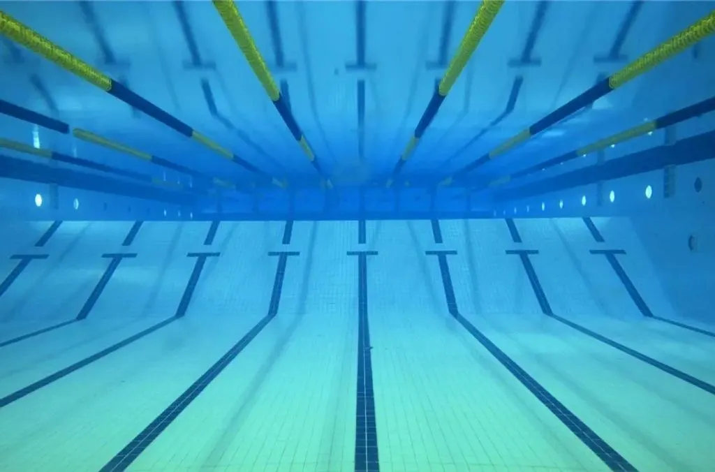 Underwater view of empty swim lanes in an indoor pool